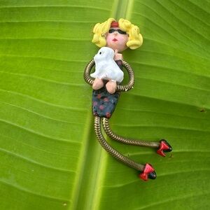 Whimiscal Brooch Pin 1990s Moveable legs Girl holding a dog SHARON ROSLUND